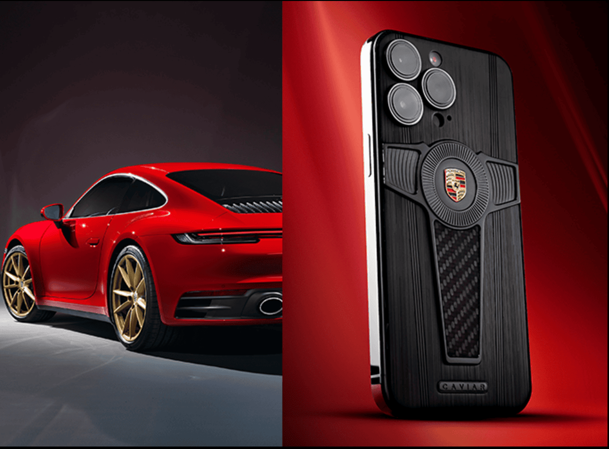 A luxury sports car with a sleek red and black design next to a smartphone with a metal and carbon fiber finish, featuring a distinctive emblem. The background is a gradient of red tones, creating a stylish and modern look.